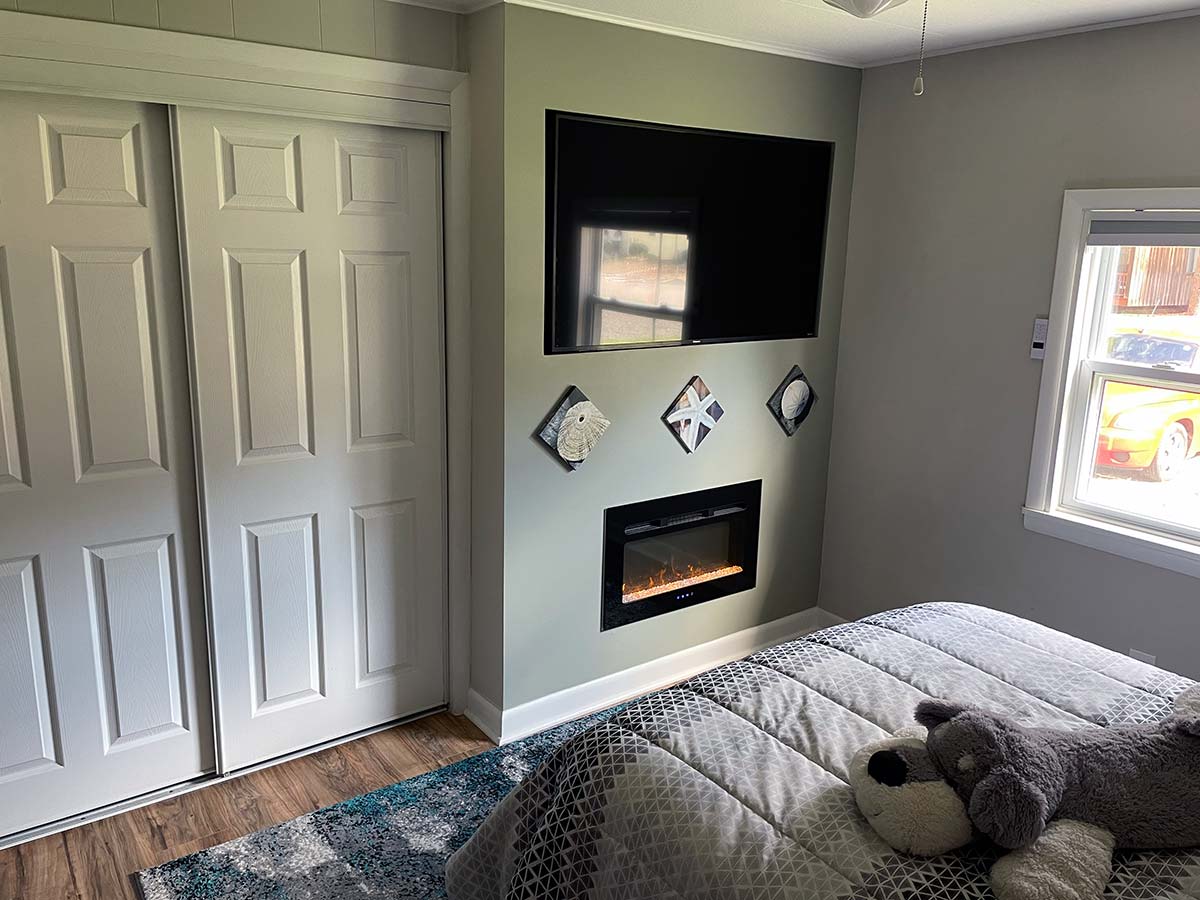 Bedroom 3 fireplace and in-wall LED television