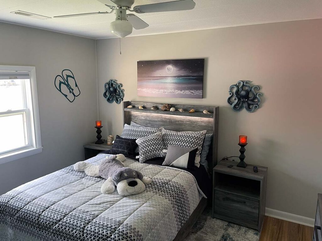 Bedroom 3 features a large screen HDTV, inwall electric fireplace, ceiling fan, and whole house sound.