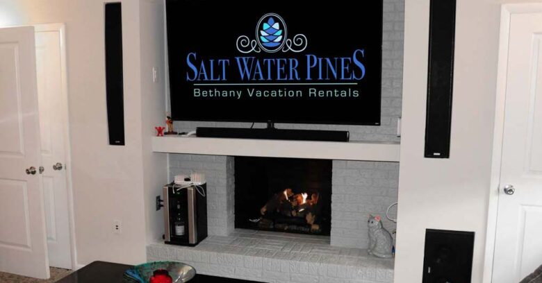 Deluxe family room with large LED TV, gas fireplace, wine chiller, and surround sound