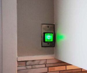 Push to exit safety locks on sliding doors