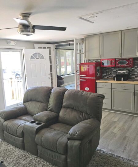 Kitchenette in family room with refrigerator/freezer, microwave, toaster oven, air fryer, and wet bar