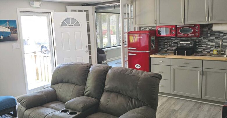 Kitchenette in family room with refrigerator/freezer, microwave, toaster oven, air fryer, and wet bar
