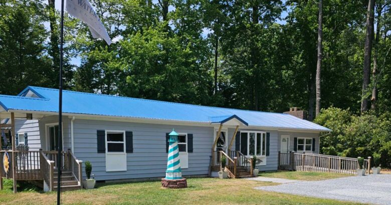Salt Water Pines Cottage 2024 with property flag