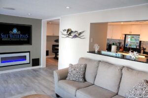 Living Room has open views to kitchen, dining room, and family room (via French doors)